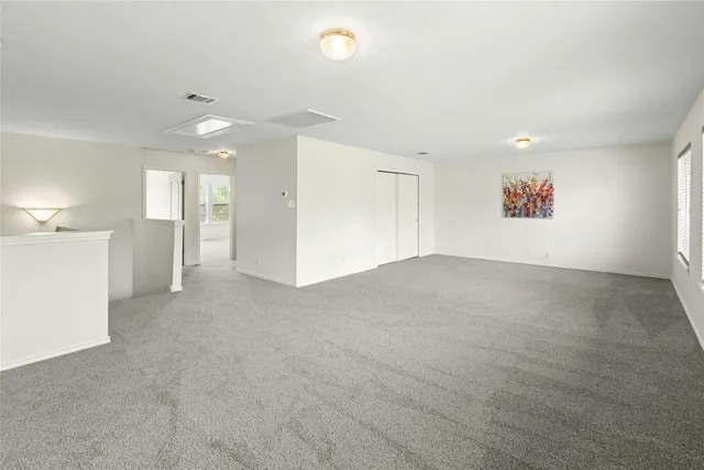 a view of a patio with a table chairs and a yard
