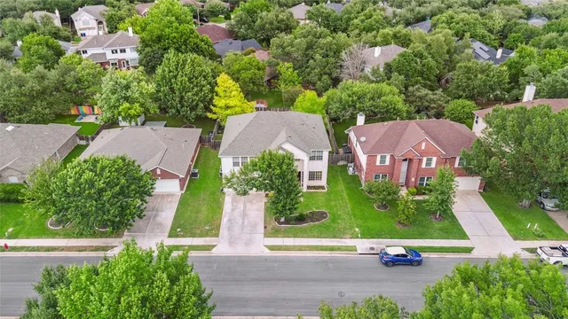 a aerial view of a house with a yard