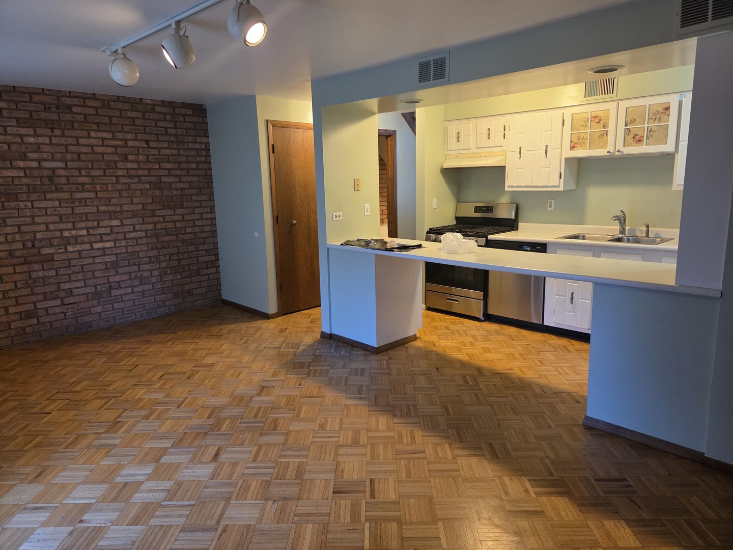 528 East Main Street Barrington, IL 60010 - Photo 6 of 18 a kitchen with a sink a stove and a refrigerator