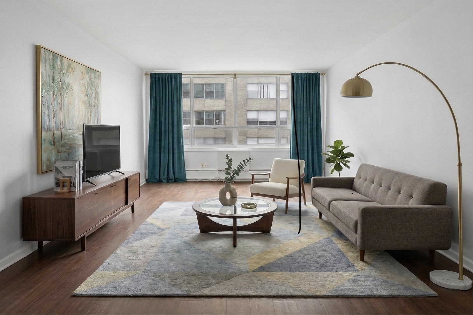 6171 North Sheridan Road, Unit 2104 Chicago, IL 60660 - Photo 2 of 18 a living room with furniture and a flat screen tv