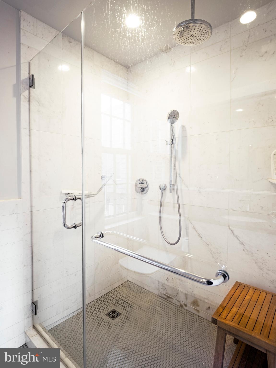 223 Carpenter Street Philadelphia, PA 19147 - Photo 30 of 42 a bathroom with a glass shower door