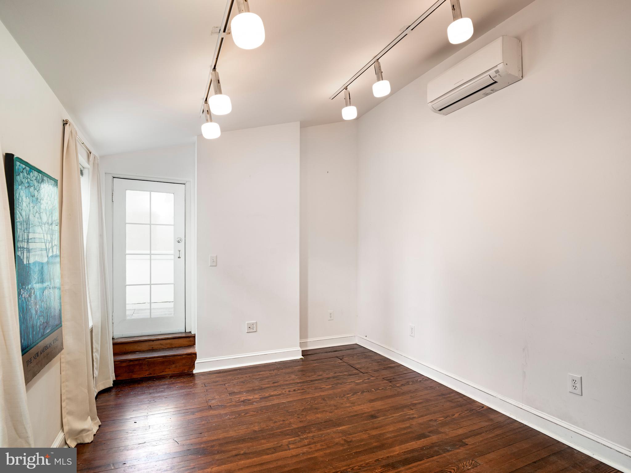 223 Carpenter Street Philadelphia, PA 19147 - Photo 33 of 42 a view of empty room with wooden floor and fan