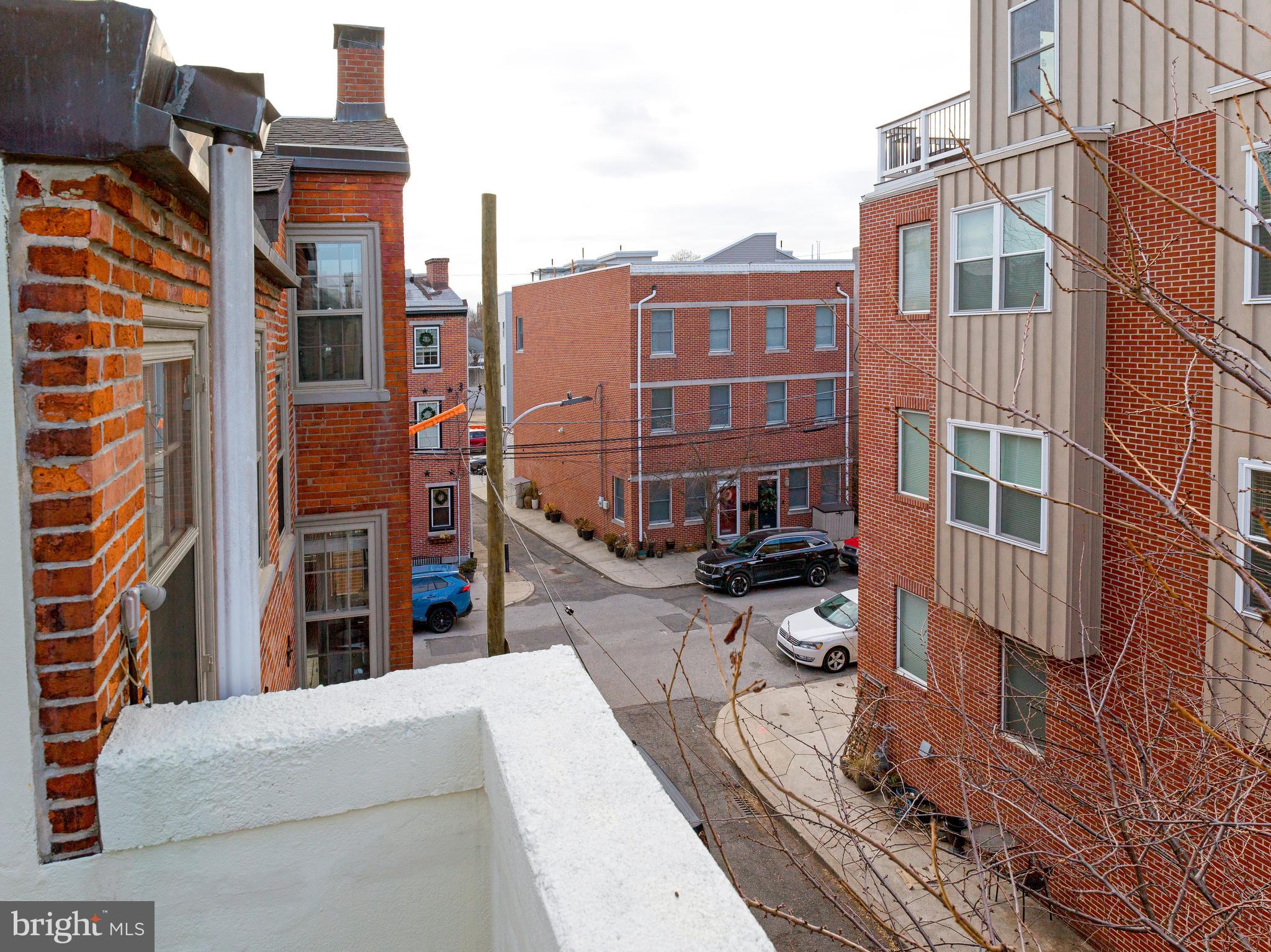 223 Carpenter Street Philadelphia, PA 19147 - Photo 34 of 42 a view of a buildings with a barbeque and wooden stairs