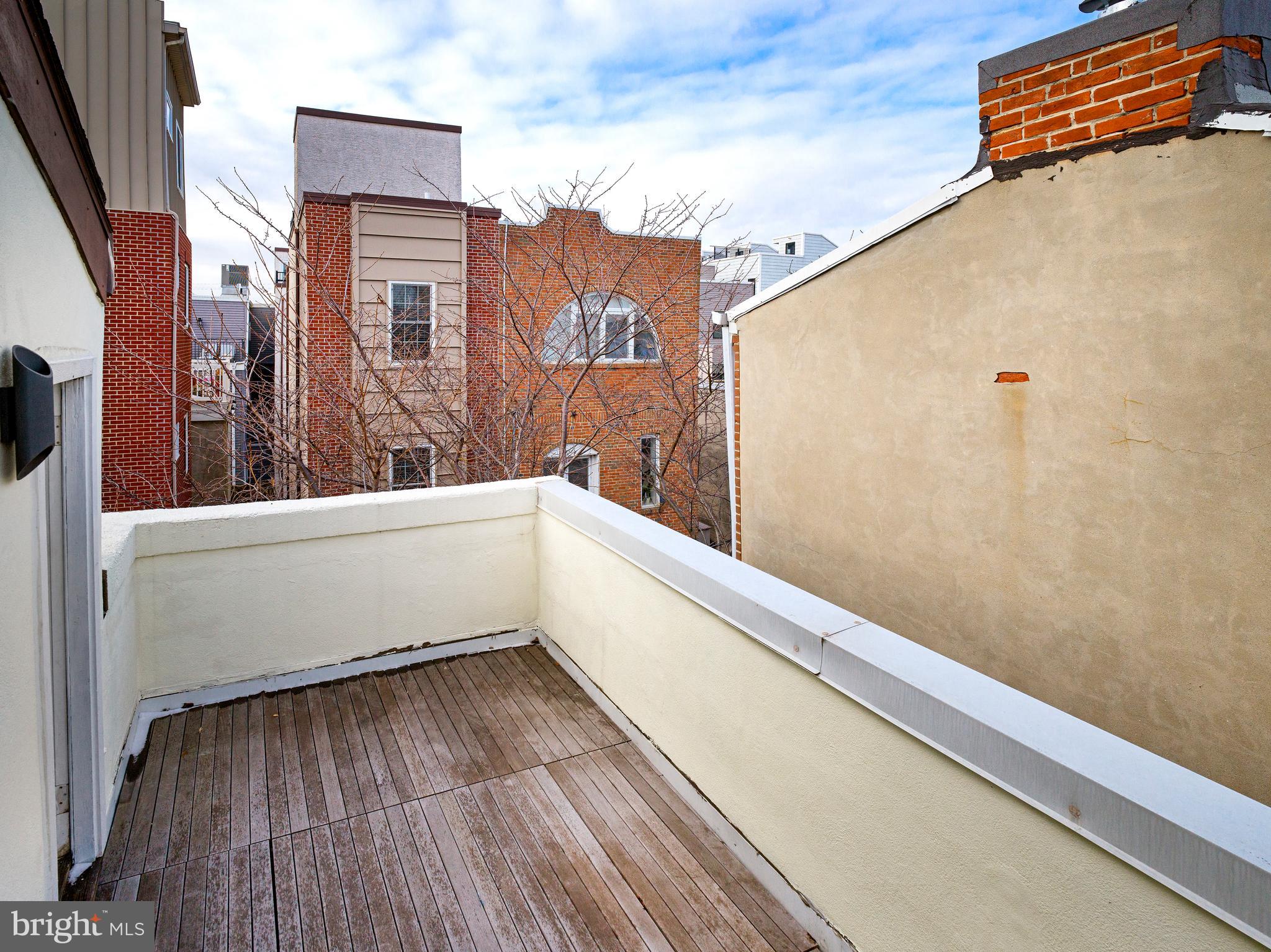 223 Carpenter Street Philadelphia, PA 19147 - Photo 35 of 42 a view of balcony with wooden floor