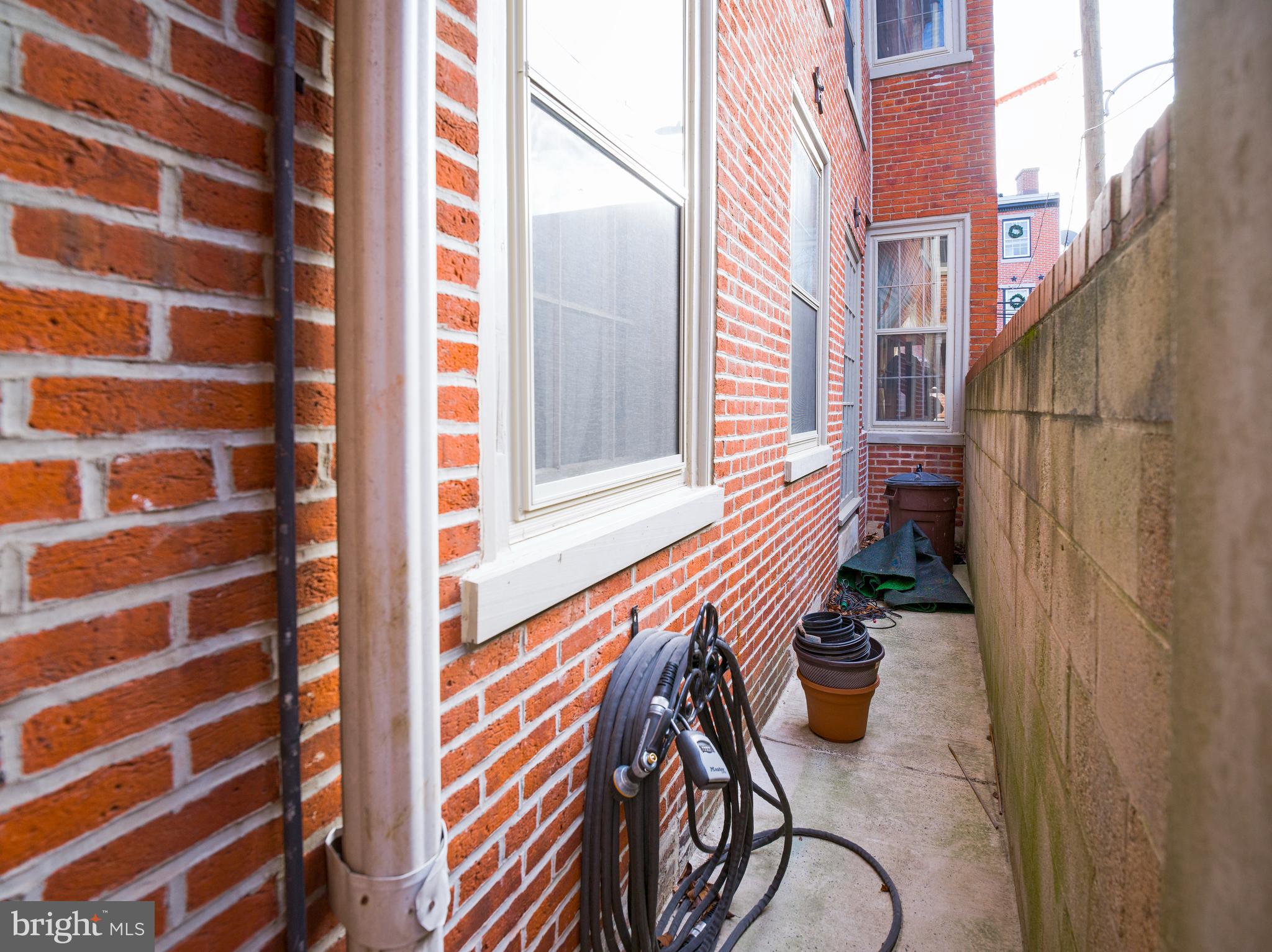 223 Carpenter Street Philadelphia, PA 19147 - Photo 9 of 42 a view of a balcony with furniture and wooden floor