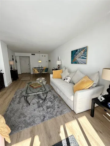 a bed room with a bed mirror and couch