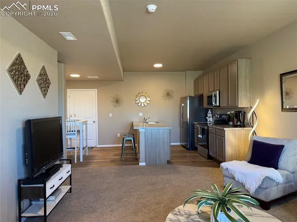 a living room with furniture and a window