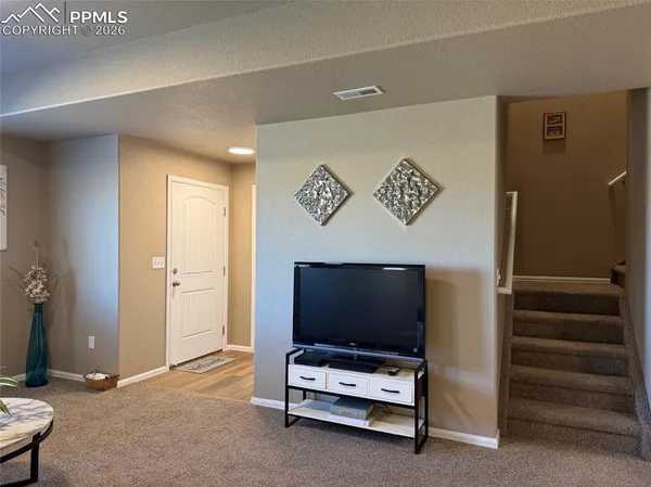 a view of kitchen and dining room with wooden floor