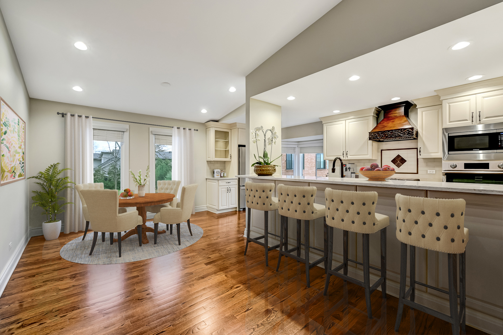 2-s719 Williamsburg Court Oak Brook, IL 60523 - Photo 14 of 48 a kitchen with stainless steel appliances granite countertop a stove a refrigerator a kitchen island a dining table and chairs with wooden floor