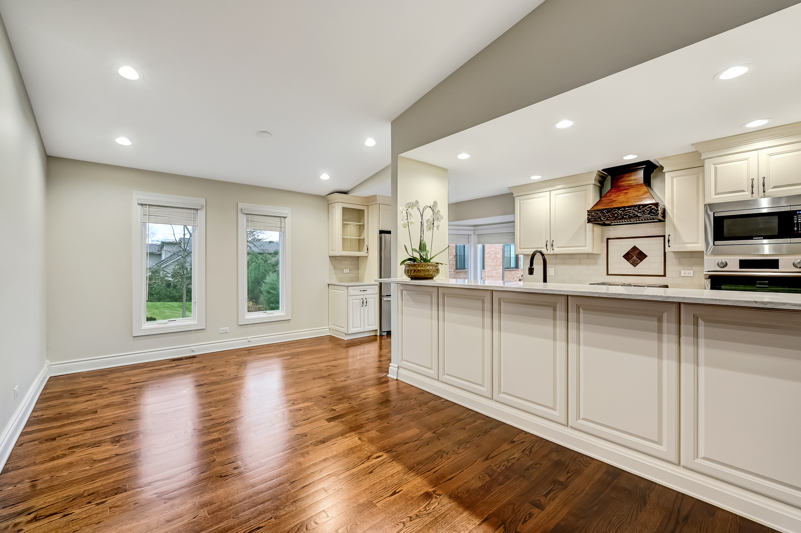 2-s719 Williamsburg Court Oak Brook, IL 60523 - Photo 15 of 48 a kitchen with stainless steel appliances granite countertop a refrigerator sink and microwave