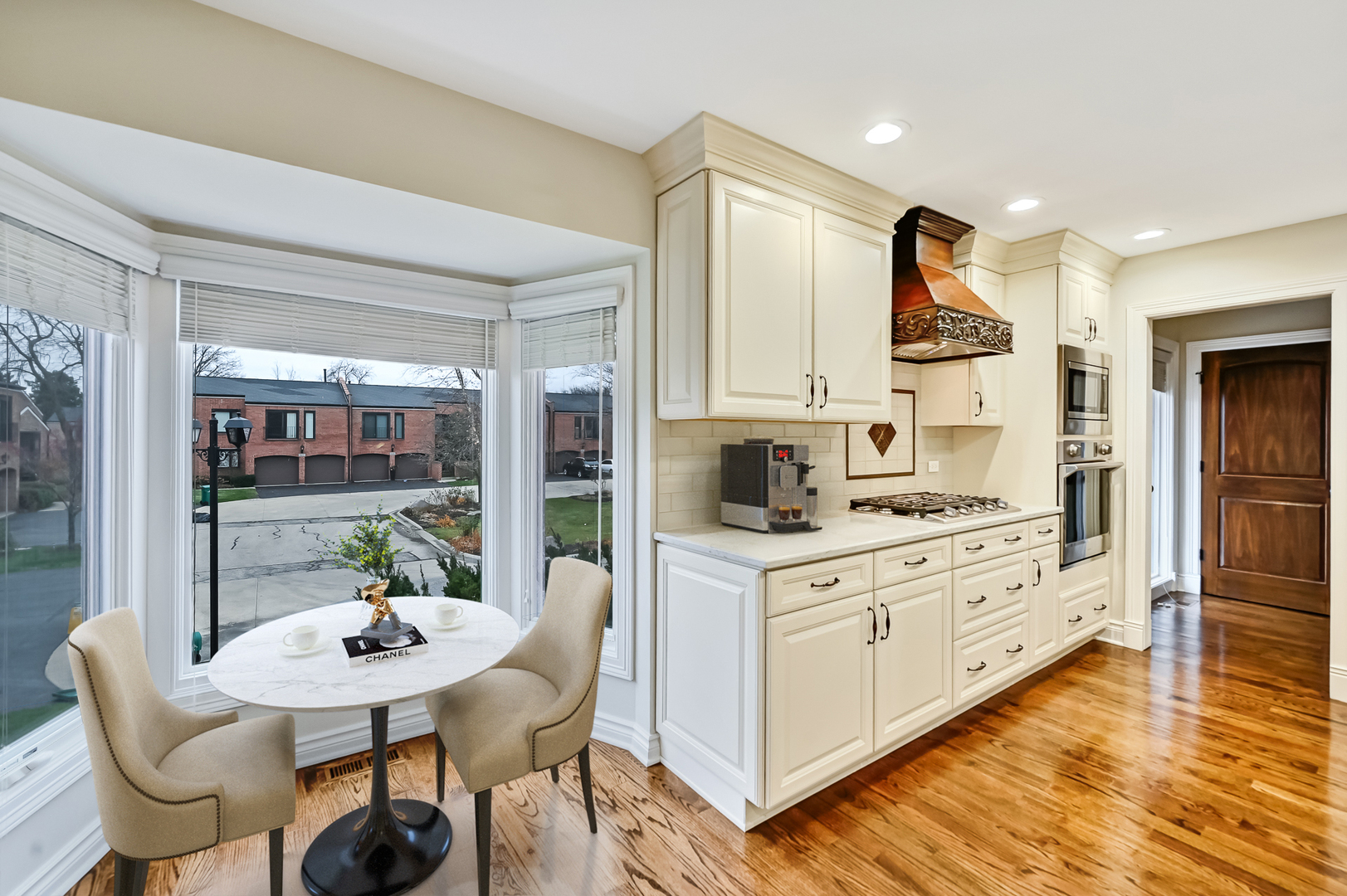 2-s719 Williamsburg Court Oak Brook, IL 60523 - Photo 19 of 48 a kitchen with stainless steel appliances kitchen island granite countertop a stove a sink and a refrigerator