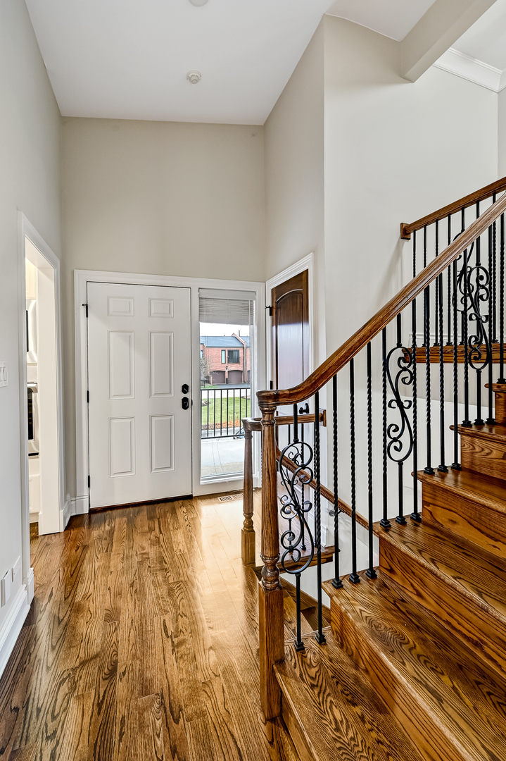 2-s719 Williamsburg Court Oak Brook, IL 60523 - Photo 23 of 48 a view of entryway with wooden floor