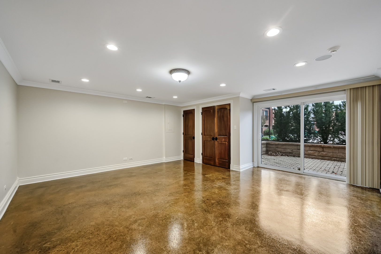2-s719 Williamsburg Court Oak Brook, IL 60523 - Photo 36 of 48 an empty room with wooden floor and windows