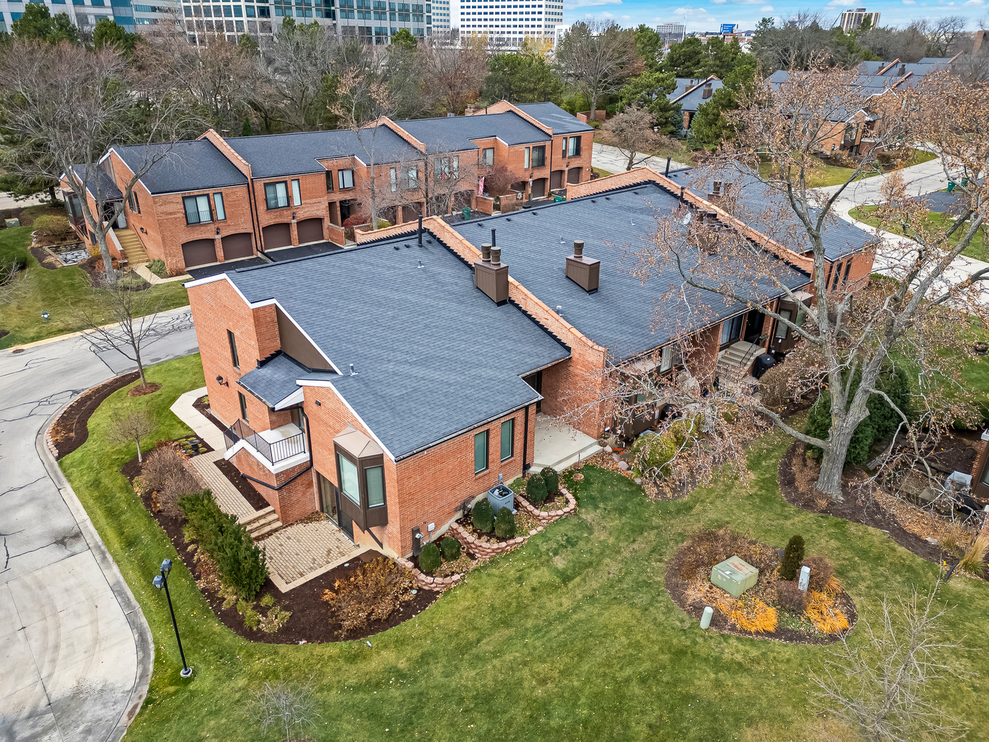 2-s719 Williamsburg Court Oak Brook, IL 60523 - Photo 4 of 48 an aerial view of a house with a garden and swimming pool
