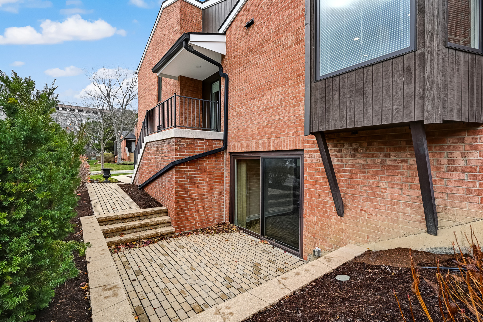 2-s719 Williamsburg Court Oak Brook, IL 60523 - Photo 7 of 48 front view of a house with a yard