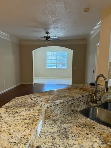 a kitchen with a stove top oven and sink