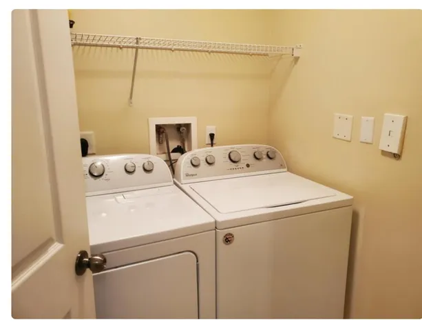 a utility room with dryer and washer