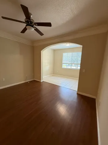 a view of an empty room and a window