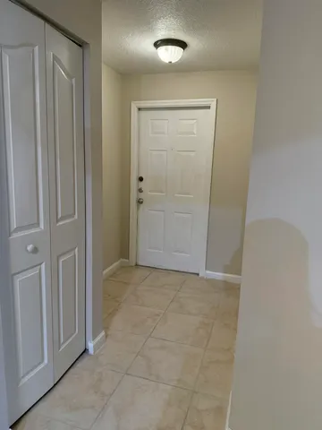 an empty room with closet area