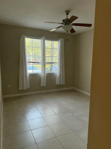 a view of an empty room with a window