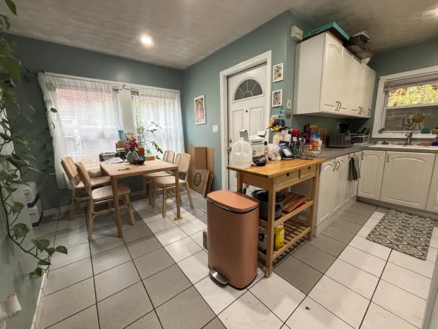 a kitchen with a stove a sink and a refrigerator