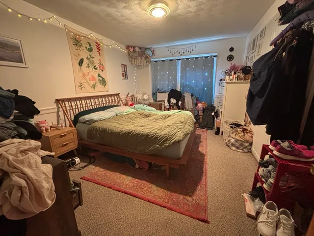 a living room with furniture gym equipment and a flat screen tv