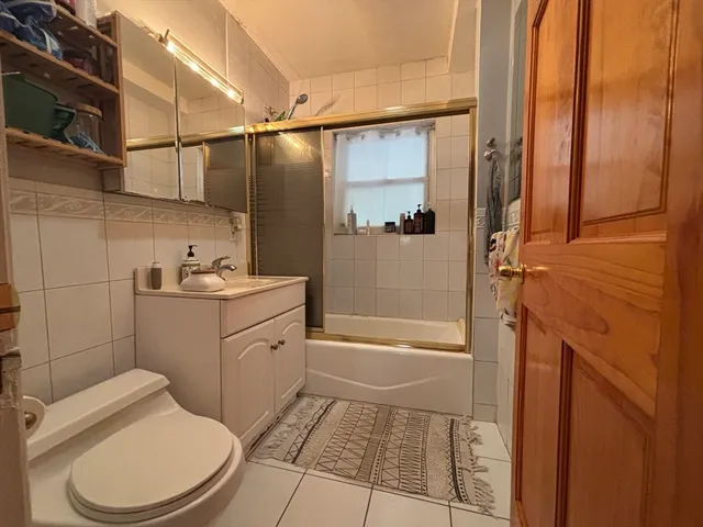 a living room with fireplace furniture and a flat screen tv