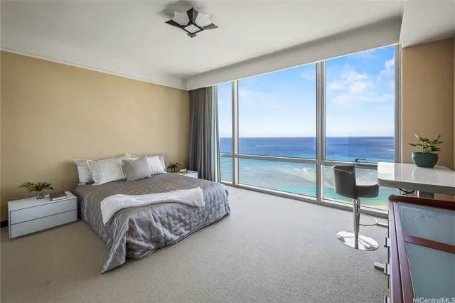 a spacious bedroom with a bed and large window