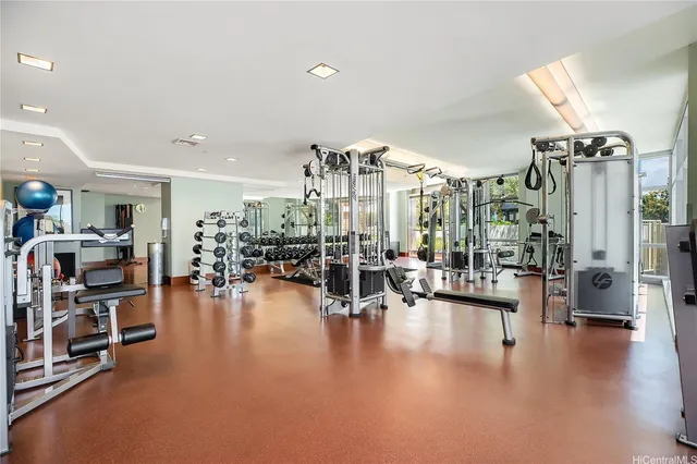 a living room with lots of furniture and a large window