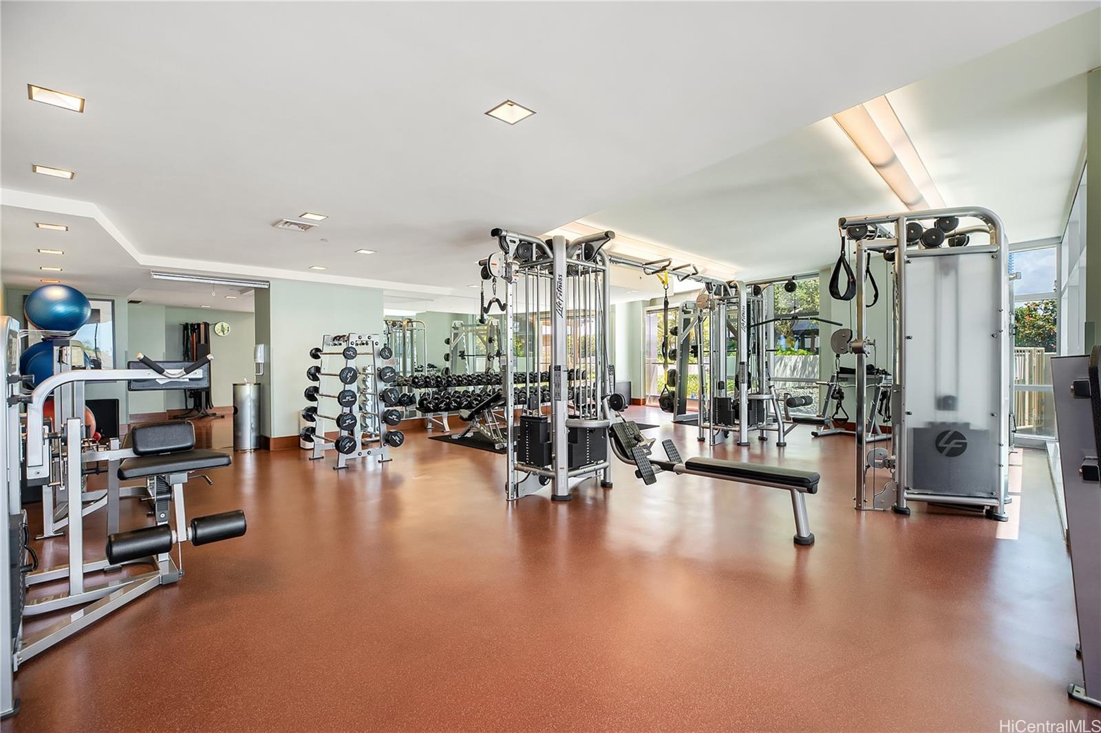 1288 Ala Moana Boulevard, Unit 37I Honolulu, HI 96814 - Photo 20 of 24 a living room with lots of furniture and a large window