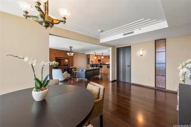 a view of a dining room with furniture and wooden floor