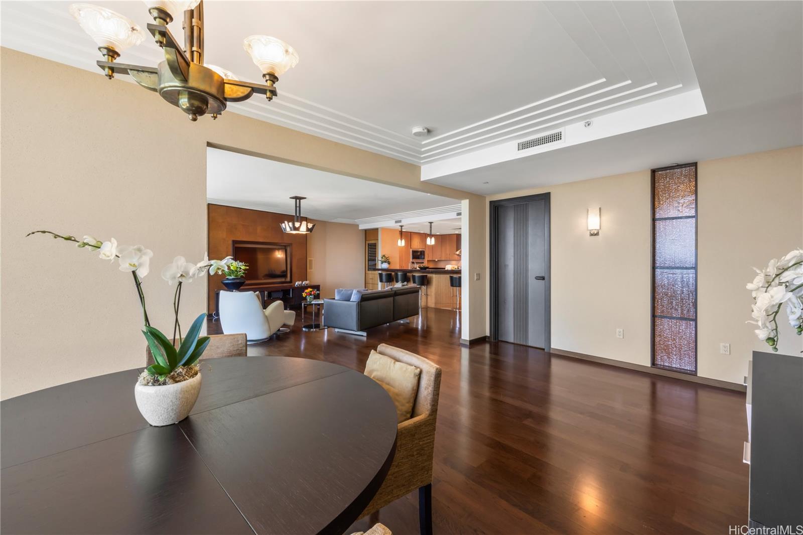1288 Ala Moana Boulevard, Unit 37I Honolulu, HI 96814 - Photo 10 of 24 a view of a dining room with furniture and wooden floor
