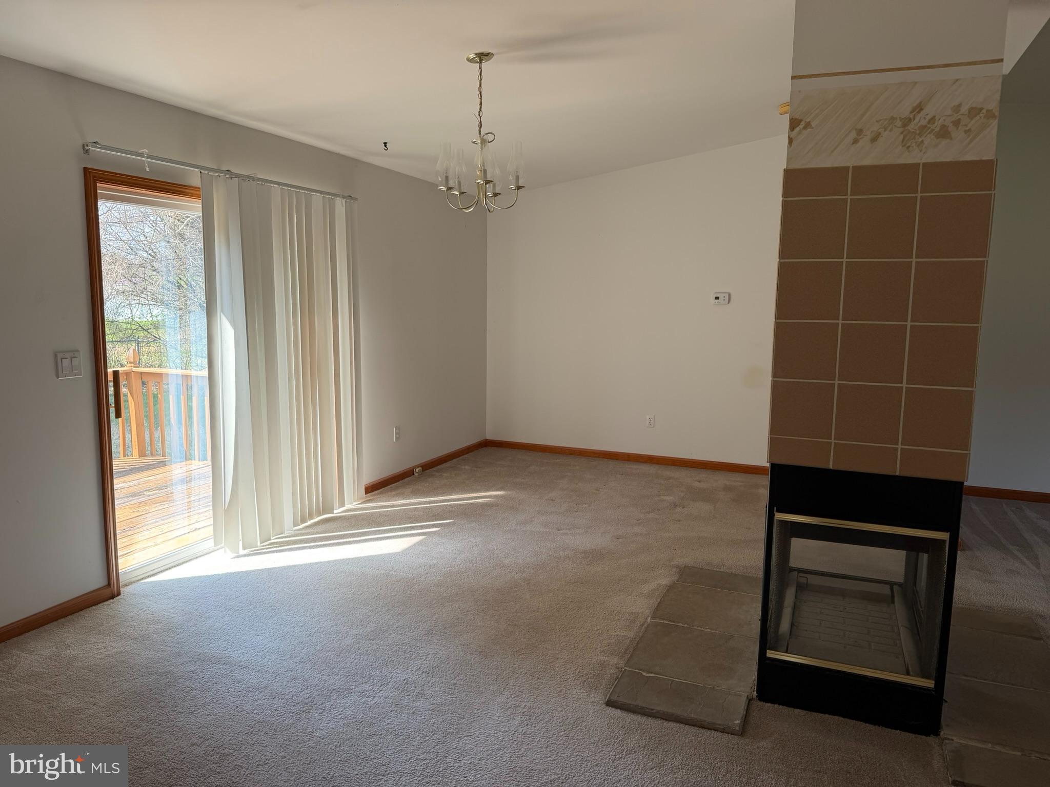 261 Andrews Lake Road Felton, DE 19943 - Photo 15 of 21 a view of an empty room with a window