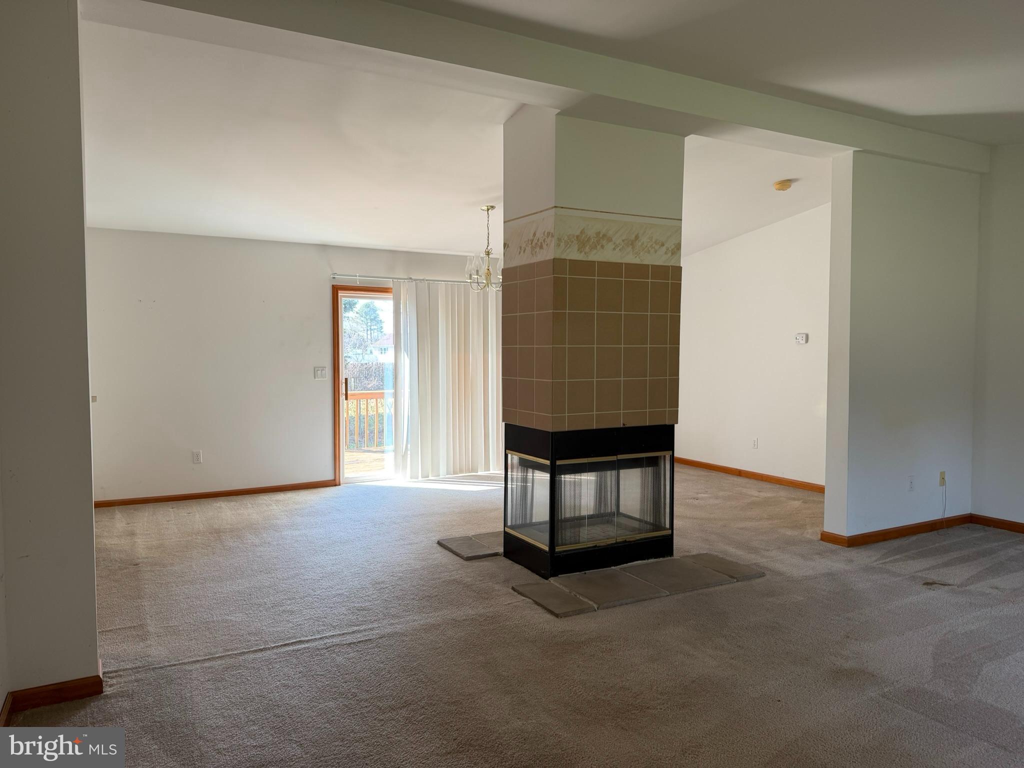 261 Andrews Lake Road Felton, DE 19943 - Photo 17 of 21 a view of an empty room with a fireplace