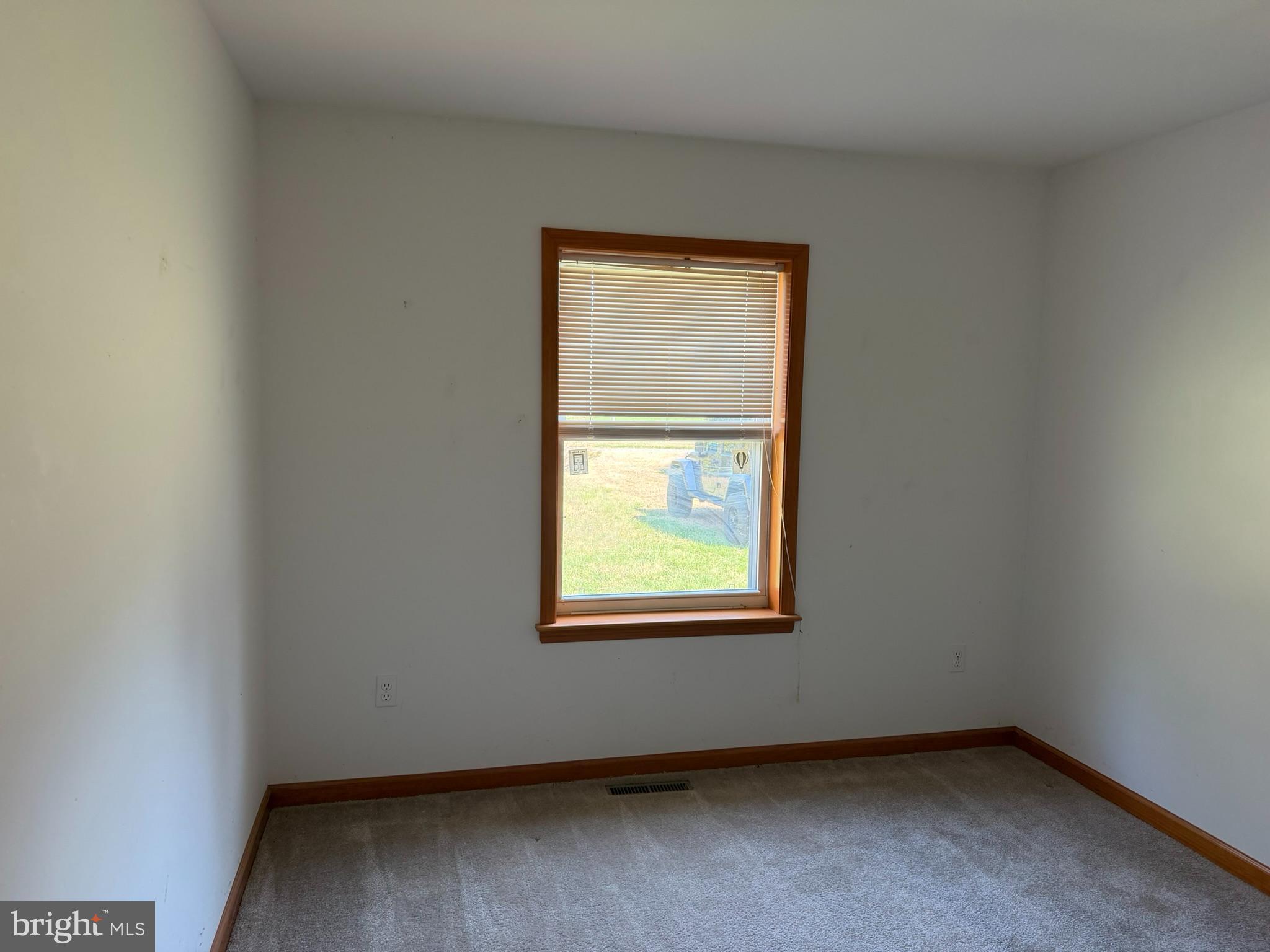 261 Andrews Lake Road Felton, DE 19943 - Photo 7 of 21 an empty room with a window