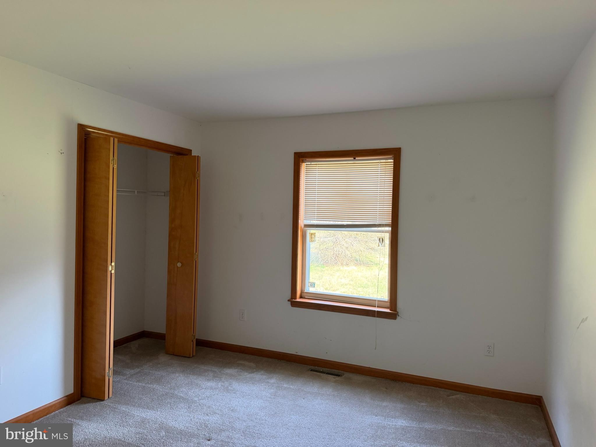 261 Andrews Lake Road Felton, DE 19943 - Photo 10 of 21 an empty room with a window