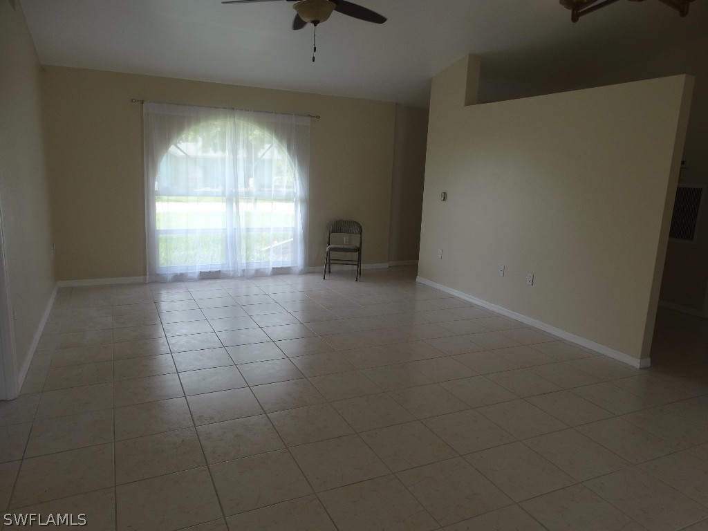 7227 Coolidge Road Fort Myers, FL 33967 - Photo 11 of 24 an empty room with windows