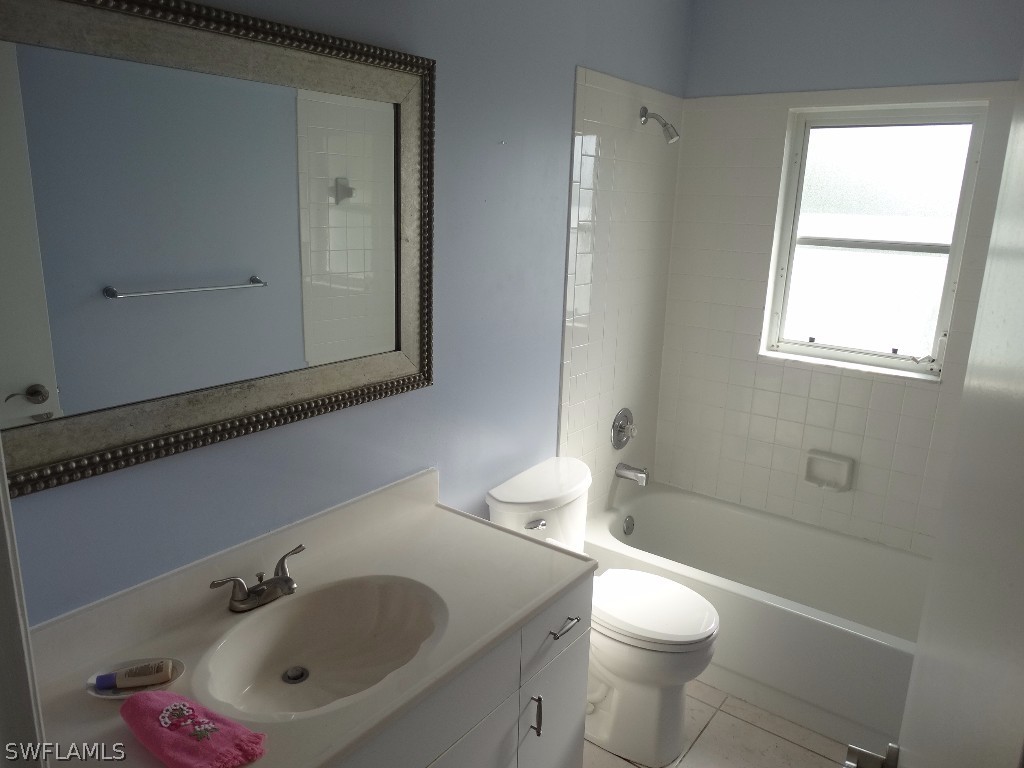 7227 Coolidge Road Fort Myers, FL 33967 - Photo 15 of 24 a bathroom with a sink a toilet and shower