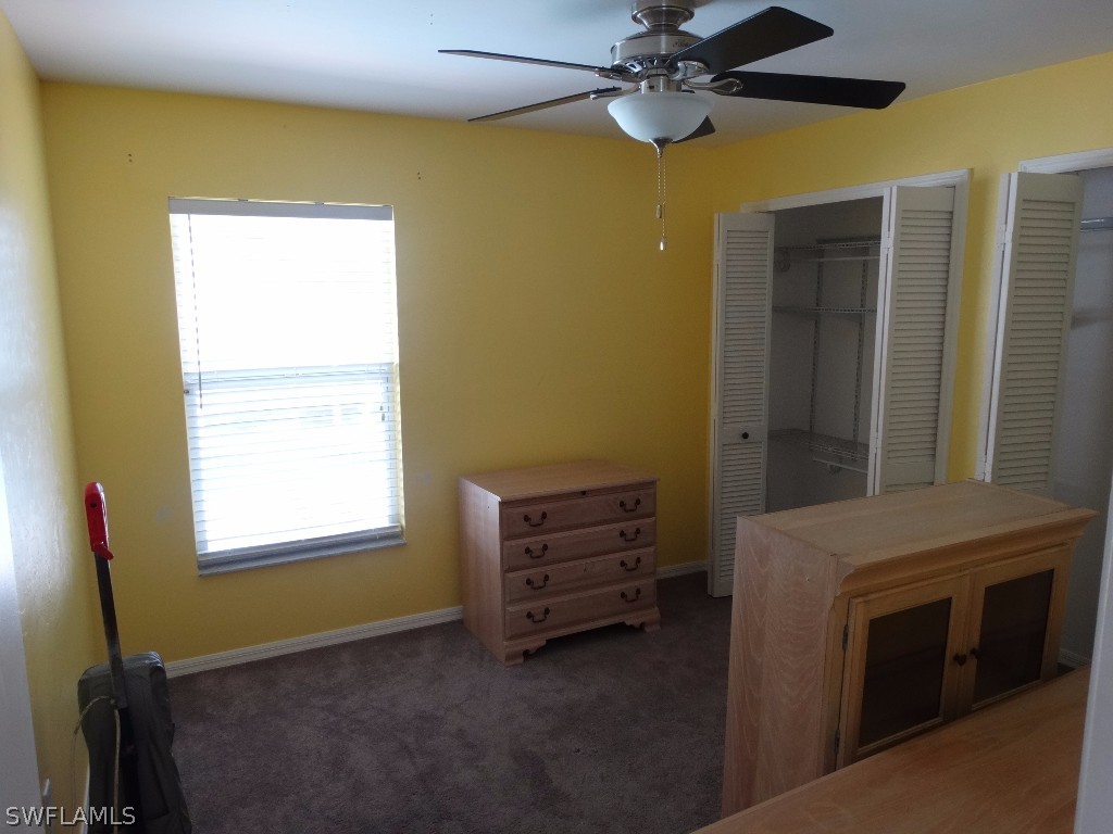 7227 Coolidge Road Fort Myers, FL 33967 - Photo 16 of 24 a view of room with window and a ceiling fan
