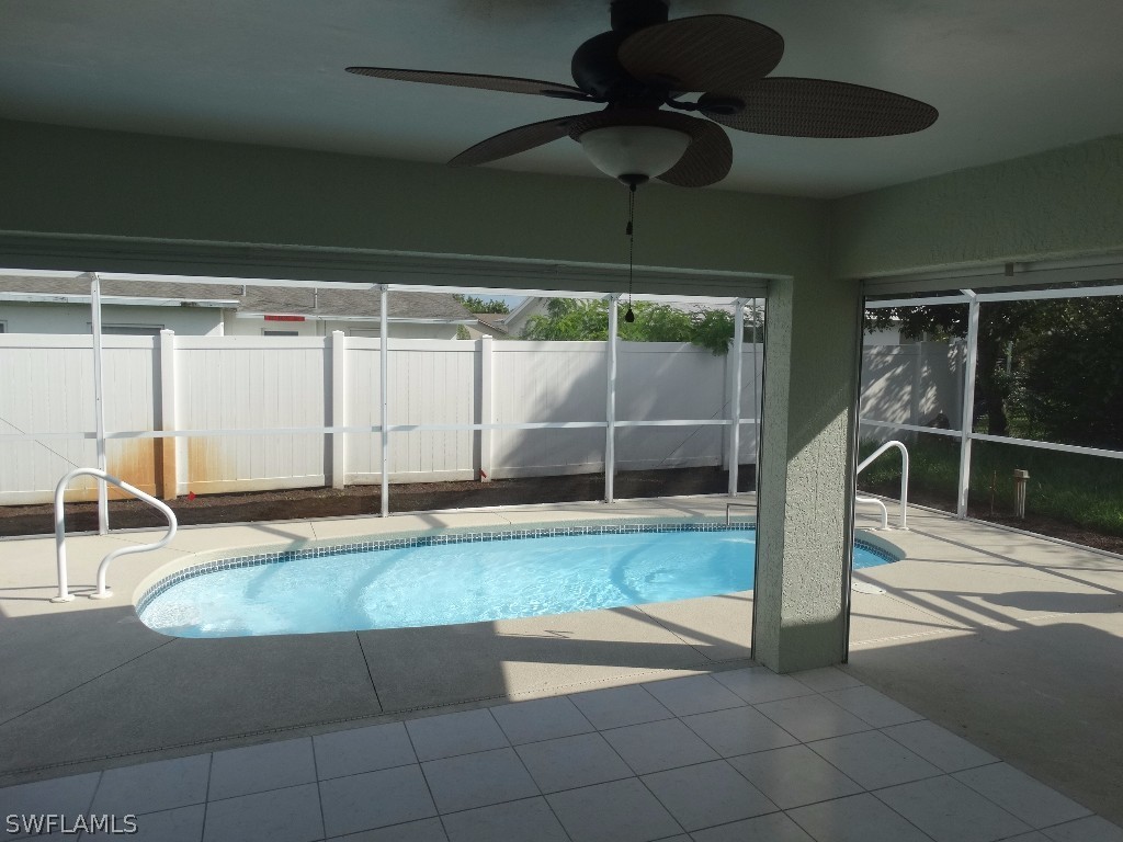 7227 Coolidge Road Fort Myers, FL 33967 - Photo 21 of 24 a view of a room with wooden floor and fan