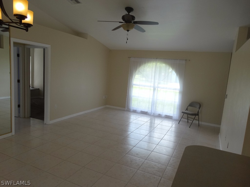 7227 Coolidge Road Fort Myers, FL 33967 - Photo 3 of 24 wooden floor in an empty room with a window