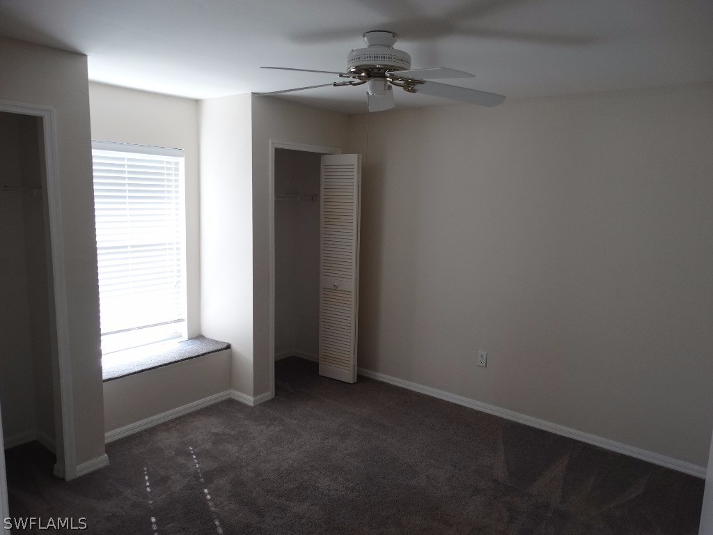 7227 Coolidge Road Fort Myers, FL 33967 - Photo 5 of 24 an empty room with windows and fan