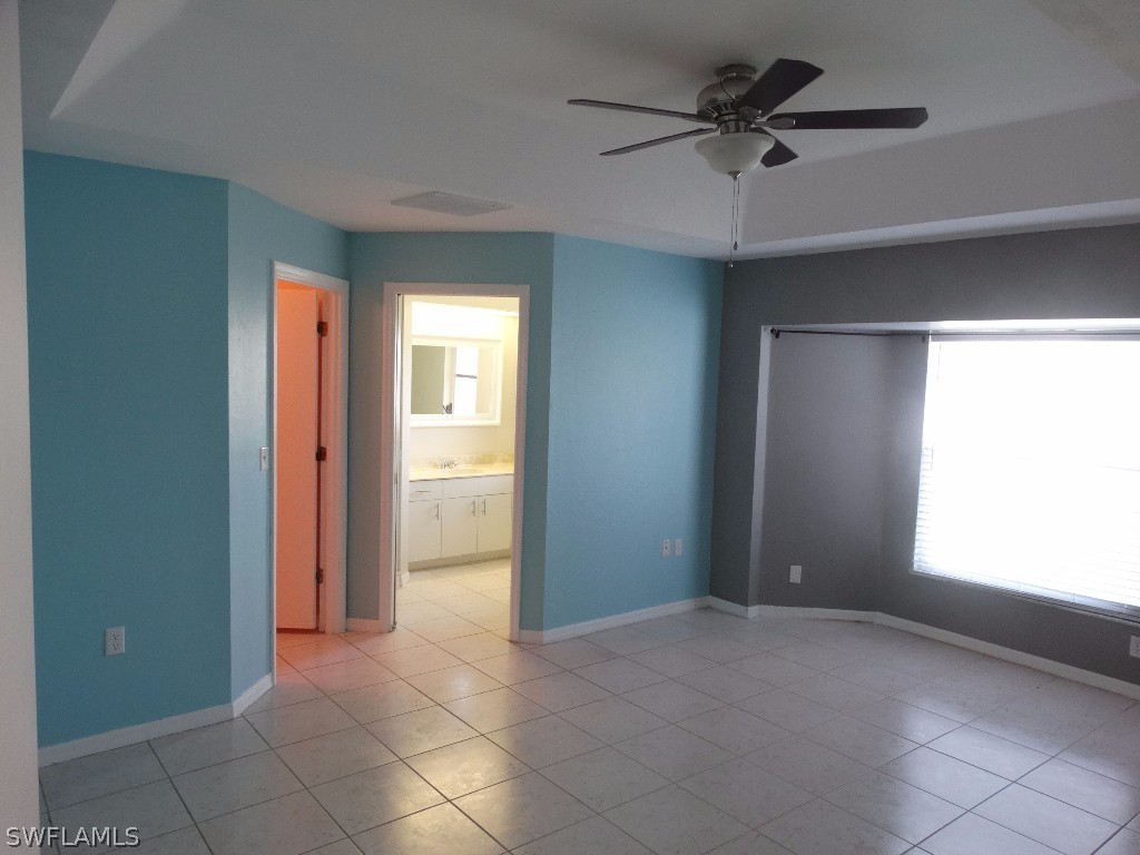 7227 Coolidge Road Fort Myers, FL 33967 - Photo 7 of 24 a view of an empty room with a window