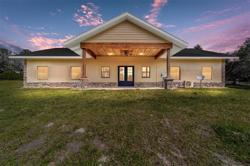 2220 Southwest 80th Street Ocala, FL 34476 - Photo 1 of 1 a front view of a house with a yard