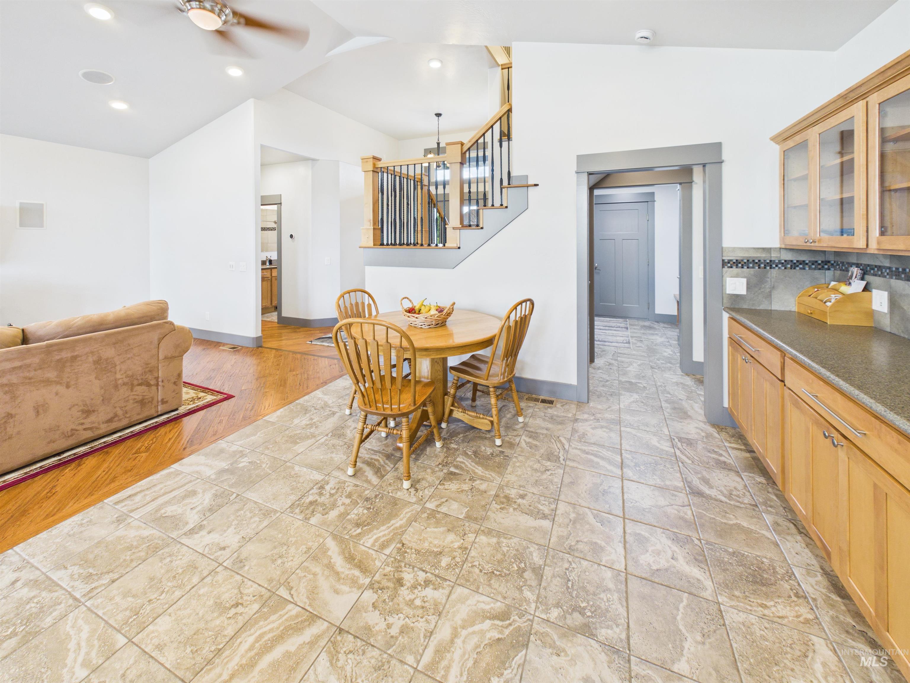 503 Heron Way Rupert, ID 83350 - Photo 13 of 49 Dining room featuring a ceiling fan and vaulted ceiling
