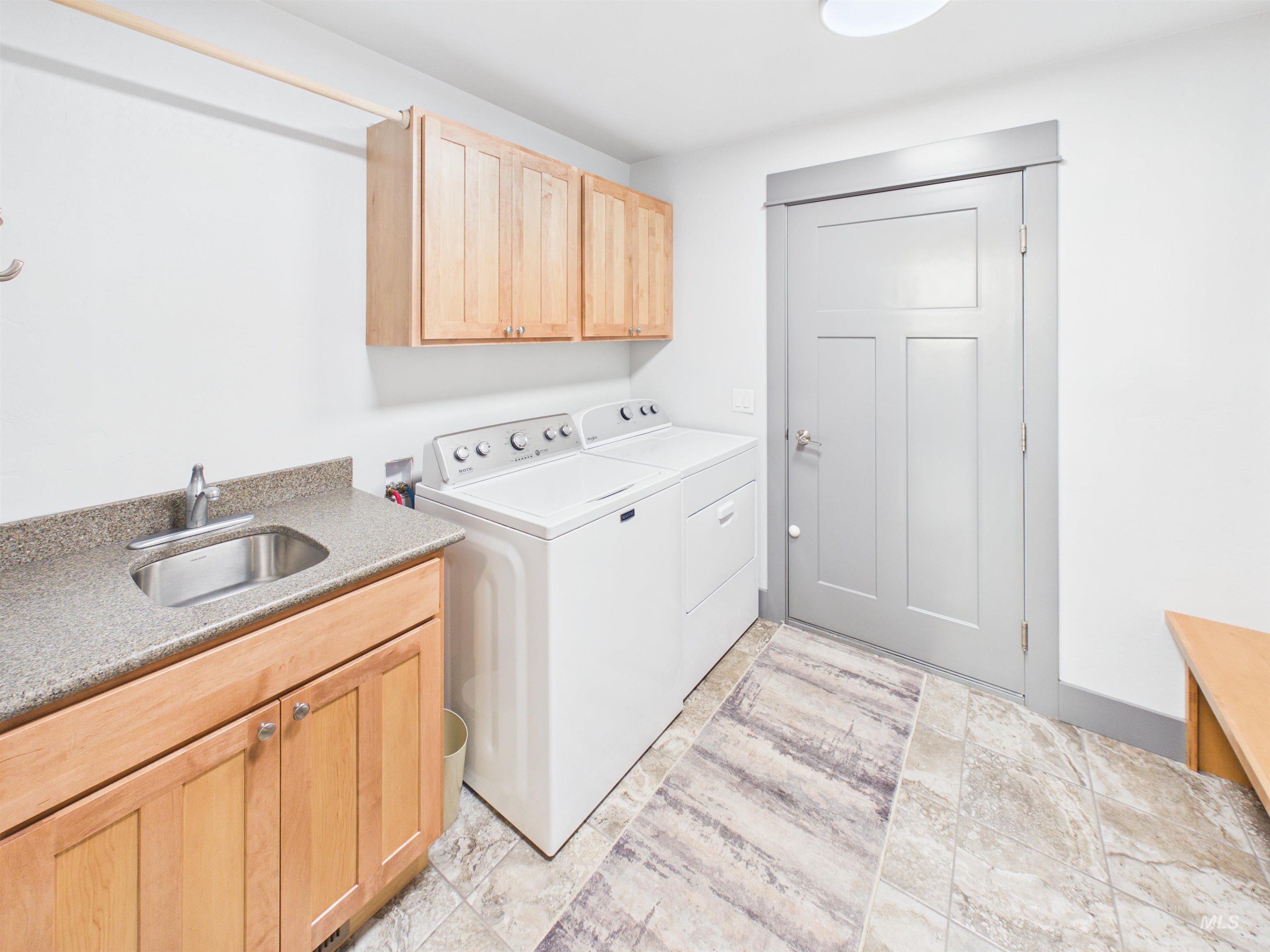503 Heron Way Rupert, ID 83350 - Photo 14 of 49 Laundry area with cabinet space and separate washer and dryer