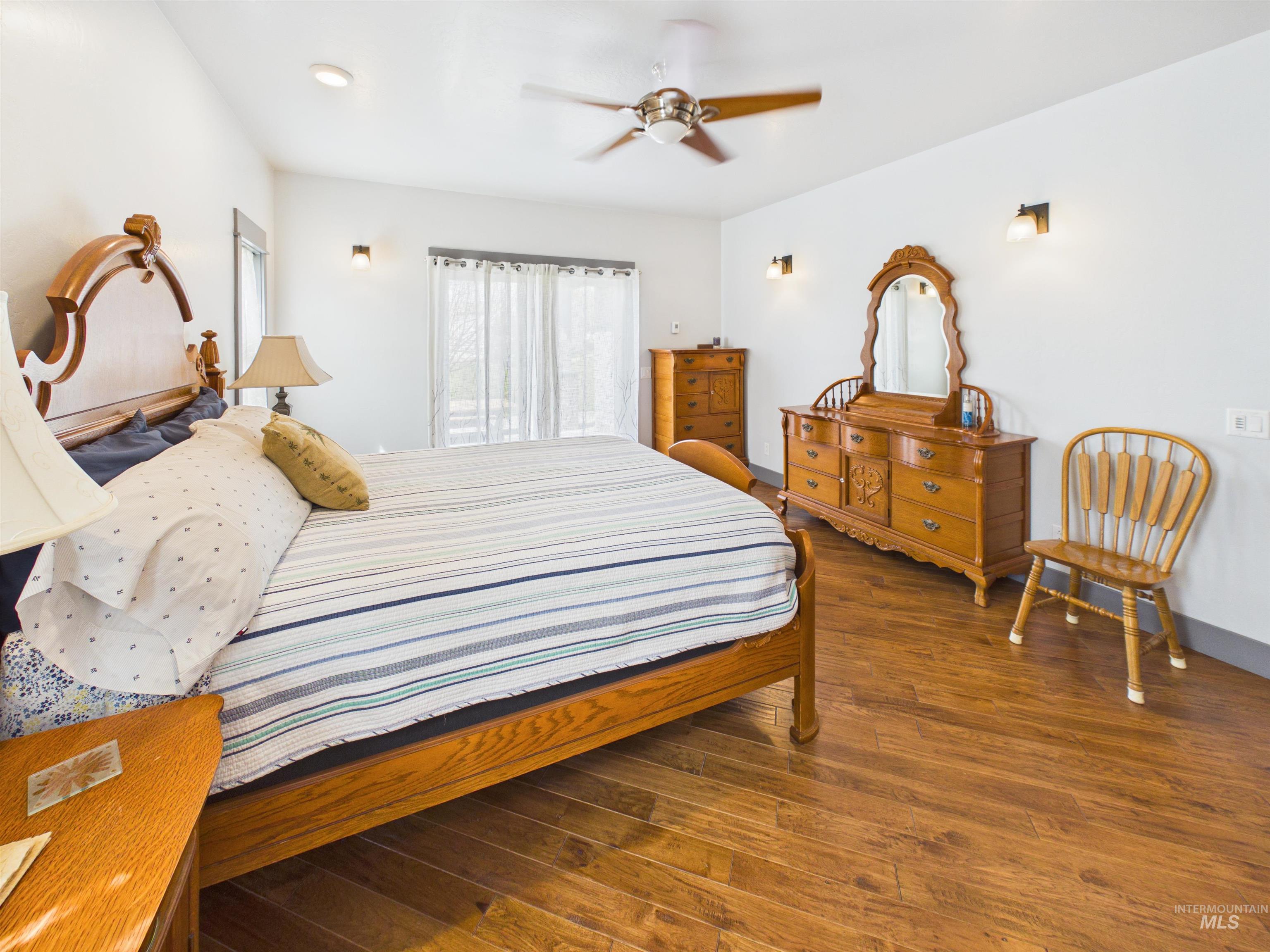 503 Heron Way Rupert, ID 83350 - Photo 17 of 49 Bedroom featuring dark wood-type flooring and a ceiling fan