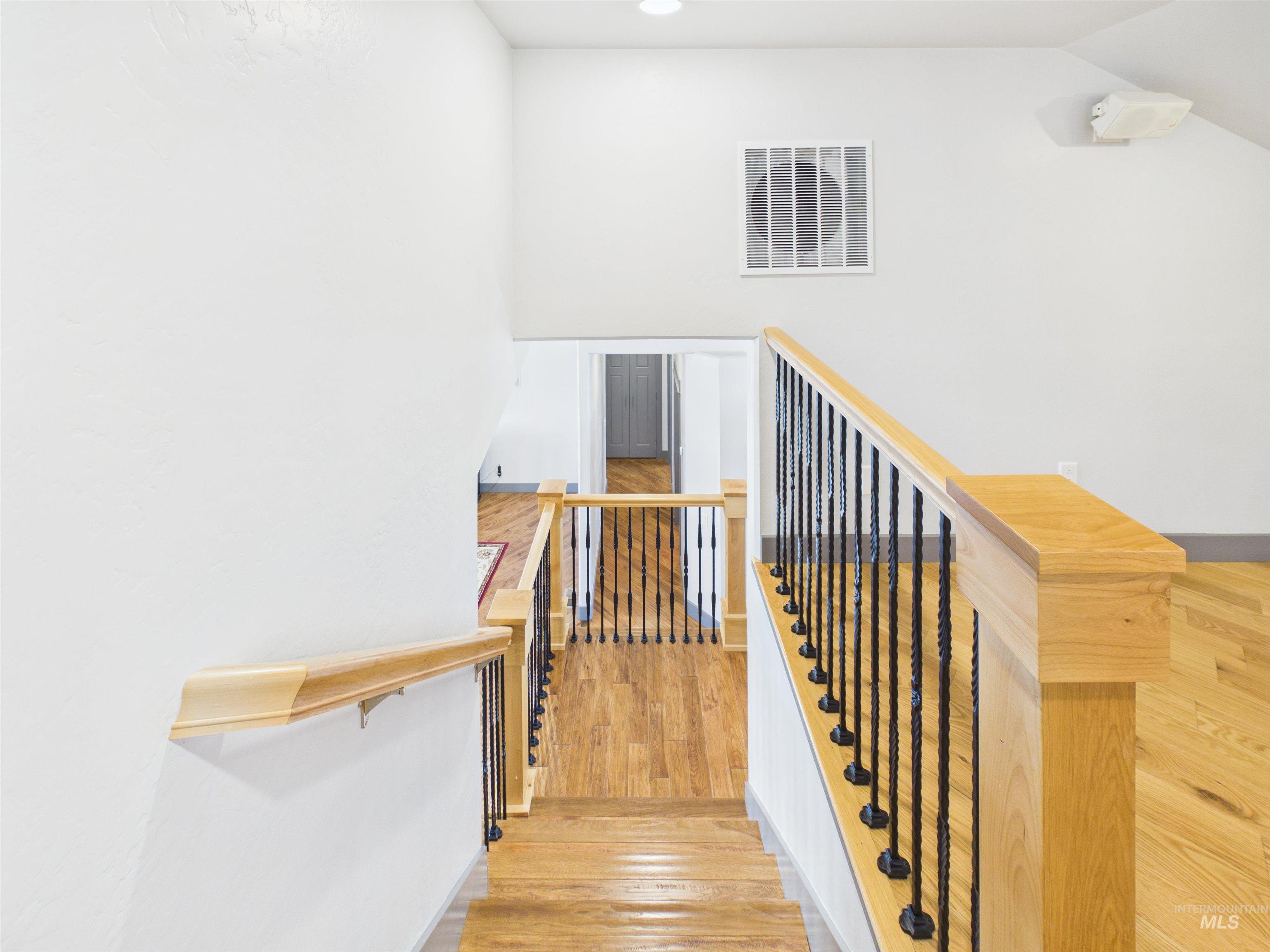 503 Heron Way Rupert, ID 83350 - Photo 32 of 49 Staircase with wood finished floors