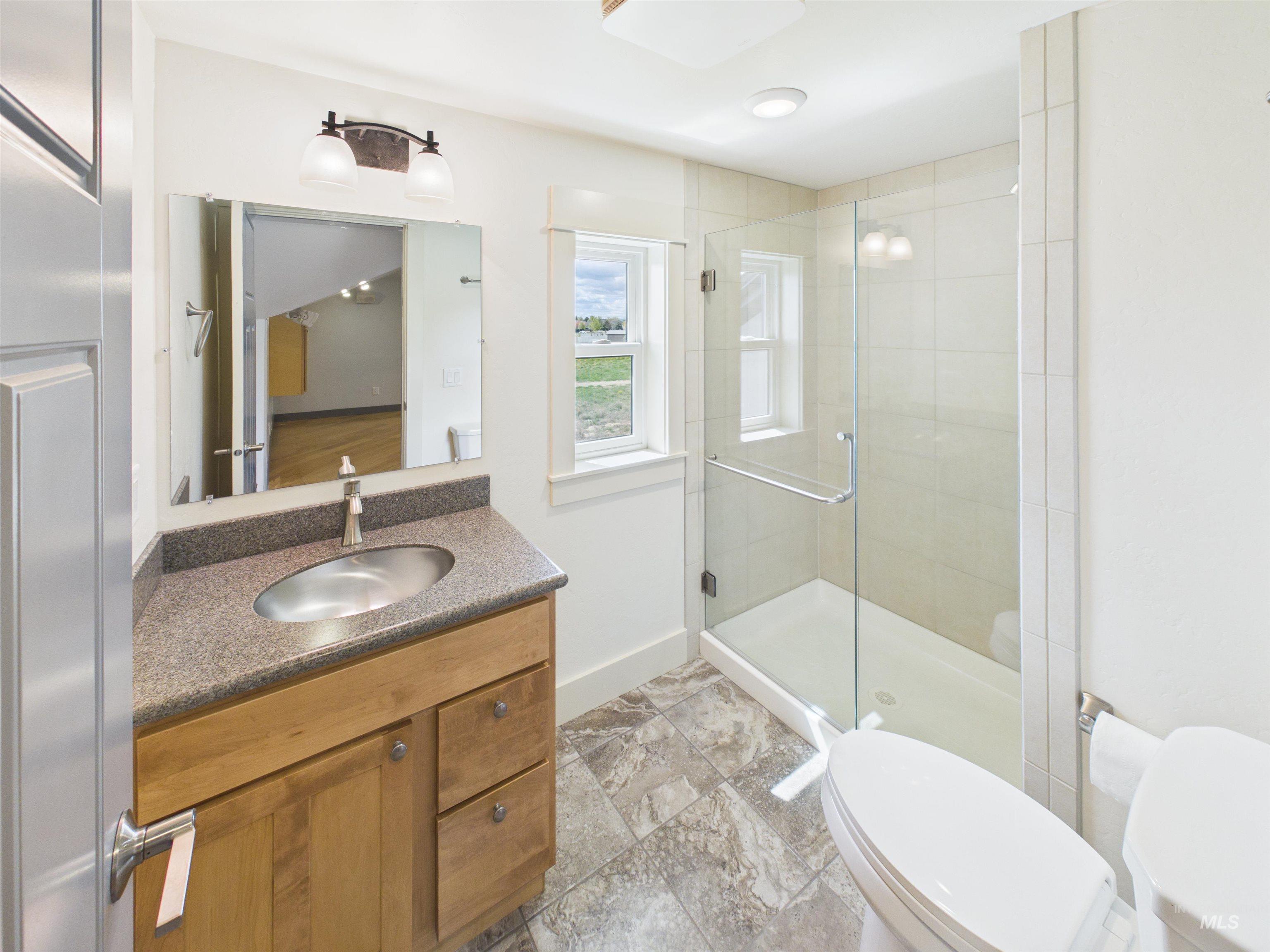 503 Heron Way Rupert, ID 83350 - Photo 35 of 49 Bathroom with vanity and a shower stall