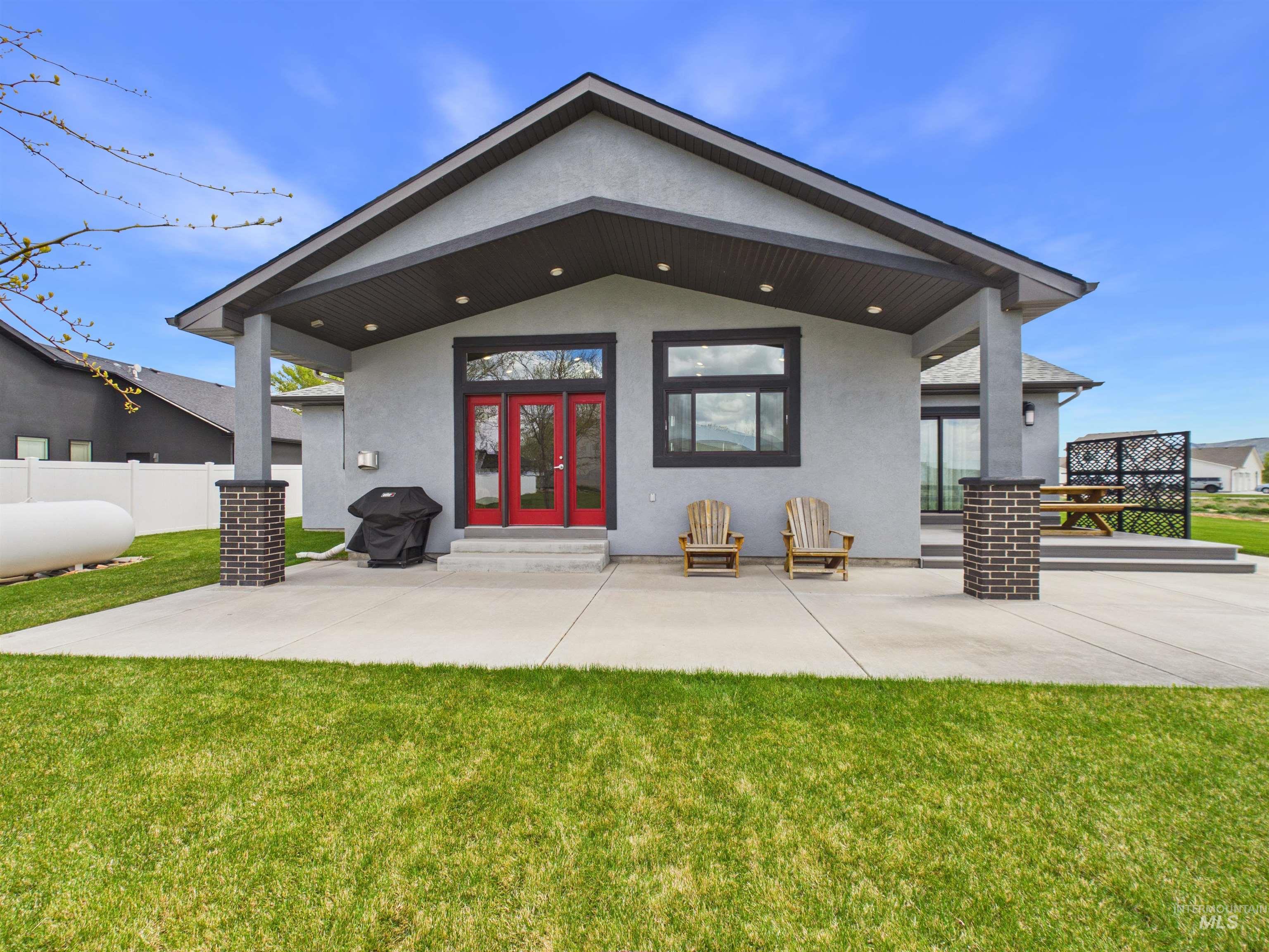 503 Heron Way Rupert, ID 83350 - Photo 42 of 49 Rear view of house featuring stucco siding, a patio area, and french doors
